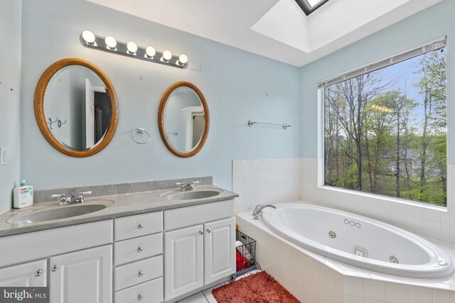 372 Daniels Rd, Barboursville, VA 22923 - bathroom with a skylight, a whirlpool tub, and double vanity
