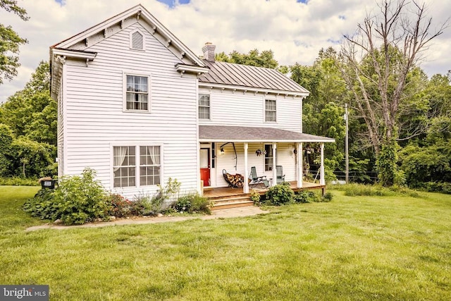 43 Briar Patch Ln, Boston, VA 22713 - view of front of property with a chimney, covered porch, a front lawn, metal roof, and a standing seam roof