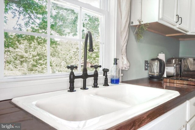43 Briar Patch Ln, Boston, VA 22713 - kitchen view of a sink, white cabinetry, and dark countertops