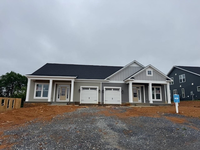 2779 Rutlege Rd Unit 194, Rockingham, VA 22801 - view of front of property featuring covered porch, a garage, board and batten siding, and driveway