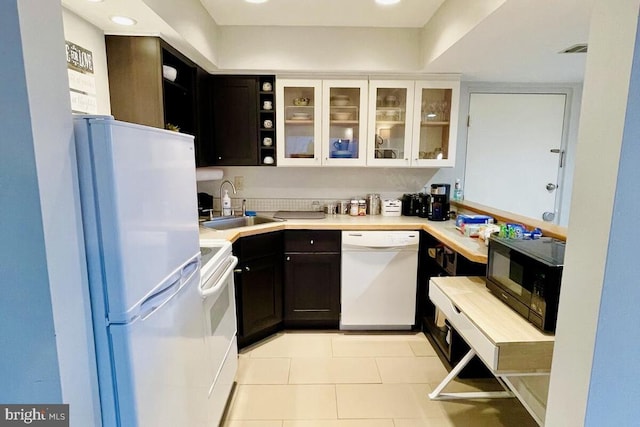 1421 Highlands, Roseland, VA 22967 - kitchen with white appliances, a sink, glass insert cabinets, light countertops, and light tile patterned floors