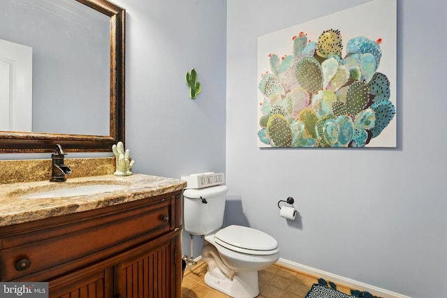 641 Keswick Dr, Culpeper, VA 22701 - half bathroom featuring vanity, toilet, tile patterned flooring, and baseboards