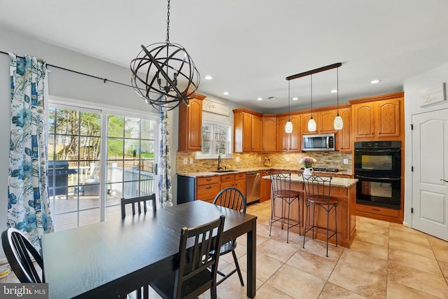 641 Keswick Dr, Culpeper, VA 22701 - kitchen with stainless steel appliances, decorative backsplash, a center island, a sink, and recessed lighting