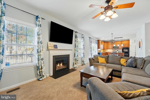 641 Keswick Dr, Culpeper, VA 22701 - living room featuring baseboards, ceiling fan, light carpet, a fireplace with flush hearth, and recessed lighting