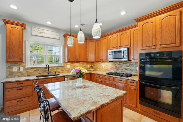 641 Keswick Dr, Culpeper, VA 22701 - kitchen featuring black appliances, a sink, a center island, light stone countertops, and light tile patterned floors
