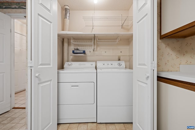 1184 Partridge Ln, Charlottesville, VA 22901 - washroom featuring washer and dryer, light tile patterned flooring, and wallpapered walls