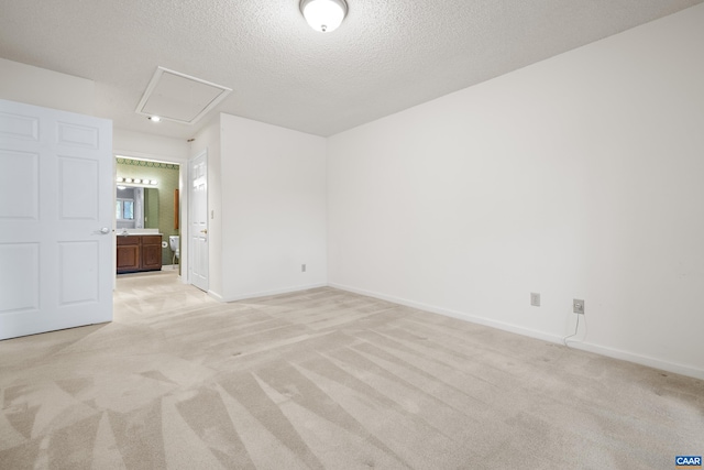 1184 Partridge Ln, Charlottesville, VA 22901 - unfurnished room featuring attic access, light colored carpet, a textured ceiling, and baseboards