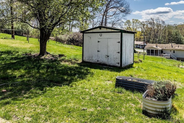 view of shed featuring fence