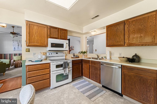 10630 Bent Tree Dr, Fredericksburg, VA 22407 - kitchen featuring ceiling fan, light countertops, a sink, and white appliances