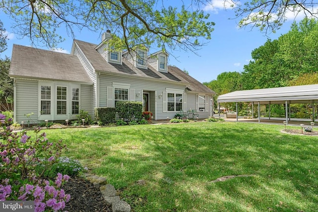 10630 Bent Tree Dr, Fredericksburg, VA 22407 - back of property featuring a yard, a chimney, and a carport