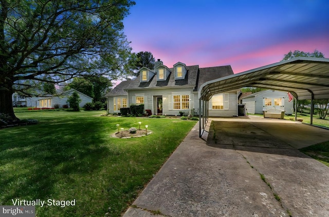 10630 Bent Tree Dr, Fredericksburg, VA 22407 - cape cod house featuring a lawn, concrete driveway, and a carport