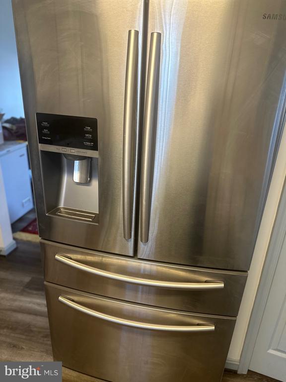 6015 Sunny Meadows Dr, Fredericksburg, VA 22407 - kitchen view of stainless steel fridge with ice dispenser and dark wood-type flooring
