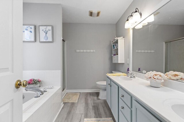 30 Beatrice Ct, Fishersville, VA 22939 - full bath with double vanity, a bath, a stall shower, and wood finished floors