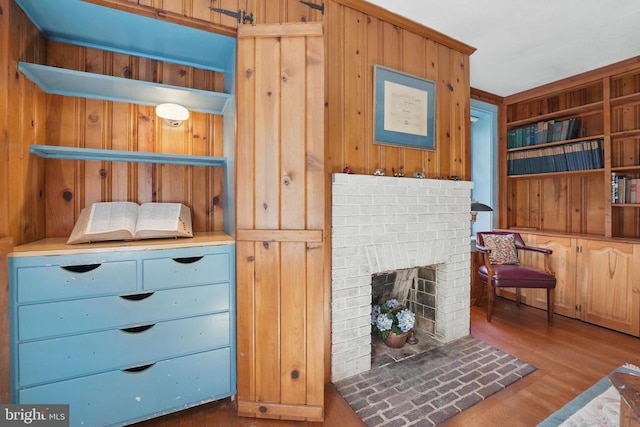 507 Winchester St, Warrenton, VA 20186 - living area featuring wooden walls, wood finished floors, and a fireplace