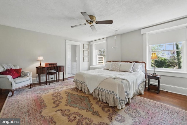 507 Winchester St, Warrenton, VA 20186 - bedroom featuring wood finished floors, baseboards, a textured ceiling, and a ceiling fan