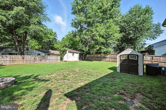  - fenced backyard featuring a storage shed