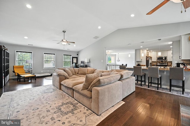  - living area featuring a ceiling fan, dark wood finished floors, healthy amount of natural light, lofted ceiling, and recessed lighting