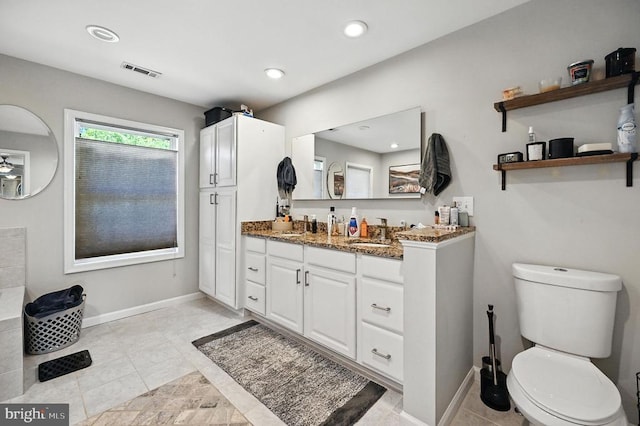  - bathroom featuring vanity, recessed lighting, and tile patterned flooring