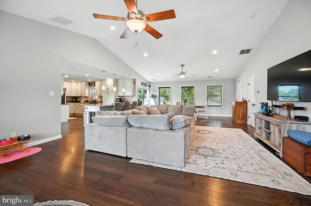  - living area featuring a ceiling fan, high vaulted ceiling, dark wood-style flooring, and recessed lighting