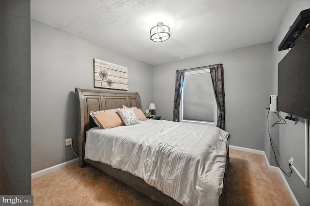  - bedroom featuring light carpet and baseboards
