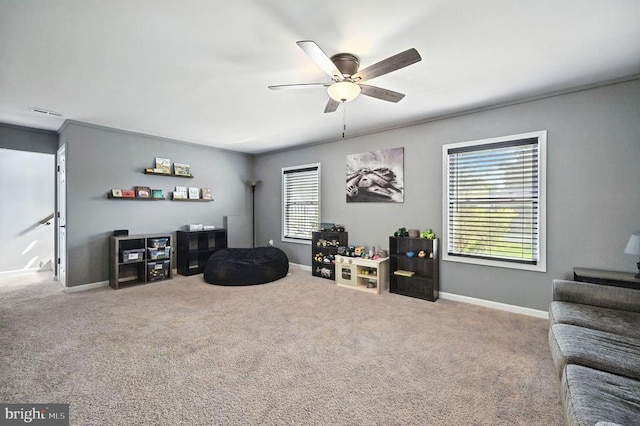  - carpeted living room featuring ceiling fan and baseboards