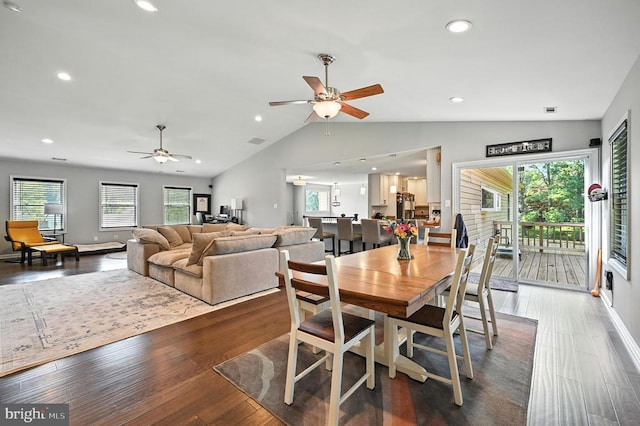  - dining room with a ceiling fan, plenty of natural light, lofted ceiling, wood finished floors, and recessed lighting