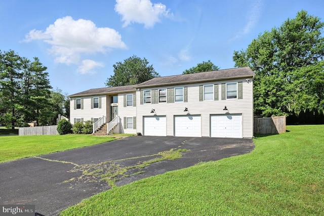  - view of front of house with driveway and a garage