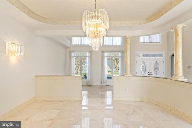 3714 Fairways Ct, Fredericksburg, VA 22408 - unfurnished dining area with a chandelier, ornate columns, baseboards, and a high ceiling