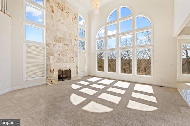 3714 Fairways Ct, Fredericksburg, VA 22408 - unfurnished living room with crown molding, carpet floors, a high ceiling, a fireplace, and baseboards