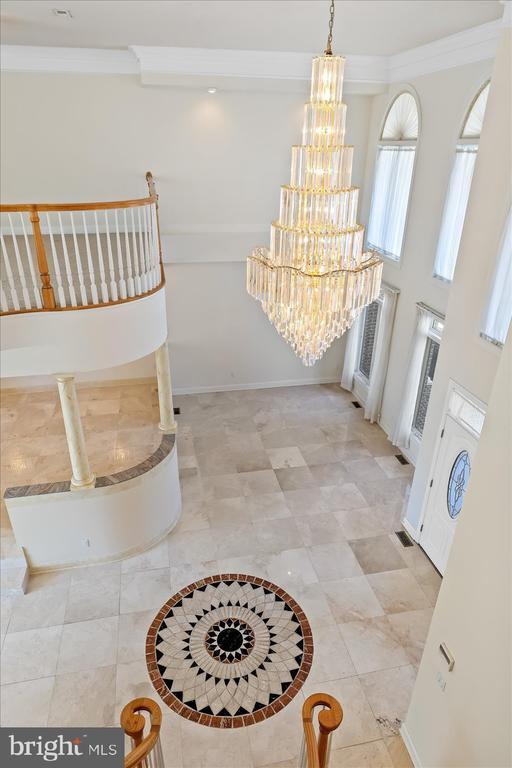 3714 Fairways Ct, Fredericksburg, VA 22408 - entrance foyer with crown molding and a chandelier