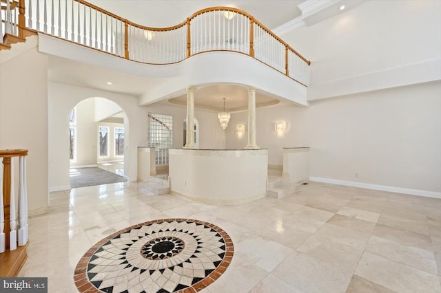 3714 Fairways Ct, Fredericksburg, VA 22408 - foyer featuring arched walkways, decorative columns, baseboards, a towering ceiling, and recessed lighting