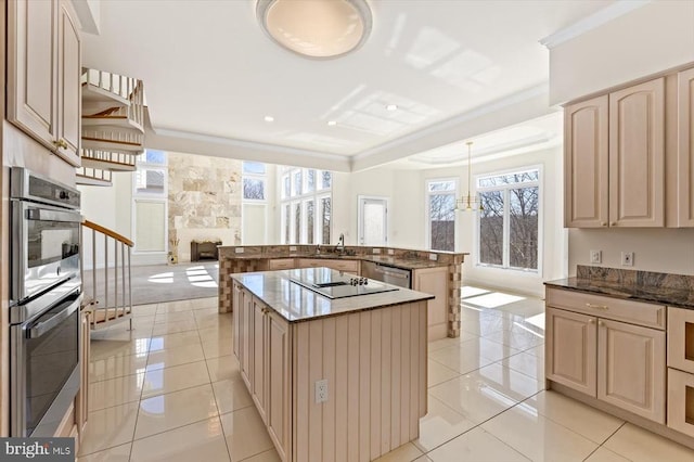 3714 Fairways Ct, Fredericksburg, VA 22408 - kitchen with appliances with stainless steel finishes, an island with sink, open floor plan, cream cabinets, and crown molding