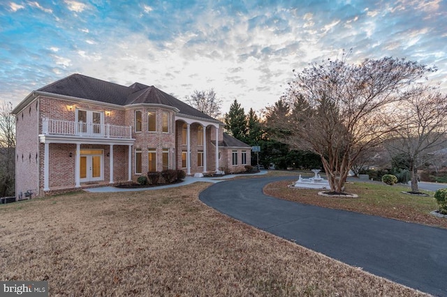 3714 Fairways Ct, Fredericksburg, VA 22408 - view of front of property with french doors, brick siding, a front yard, and a balcony