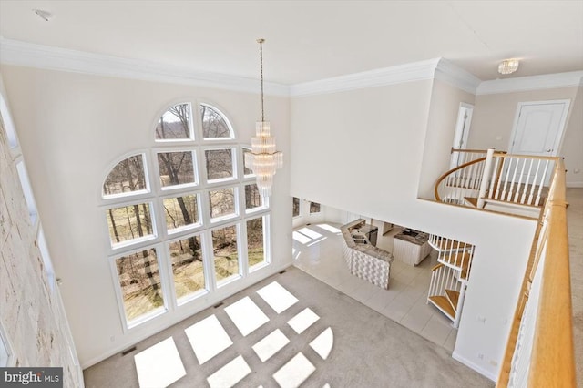 3714 Fairways Ct, Fredericksburg, VA 22408 - carpeted dining area with crown molding, a chandelier, a high ceiling, and tile patterned flooring