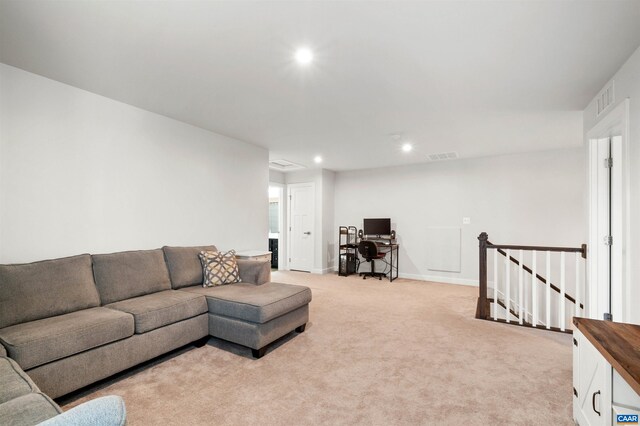 living area featuring recessed lighting, light colored carpet, a desk, and baseboards
