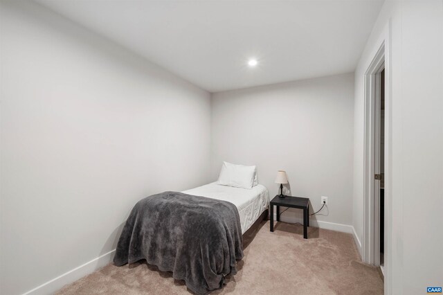 bedroom featuring light colored carpet, baseboards, and recessed lighting