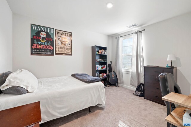 carpeted bedroom with visible vents