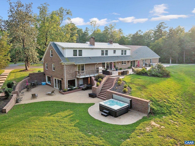 6904 James Madison Hwy, Fork Union, VA 23055 - back of house with a chimney, brick siding, a hot tub, a patio, and stairs