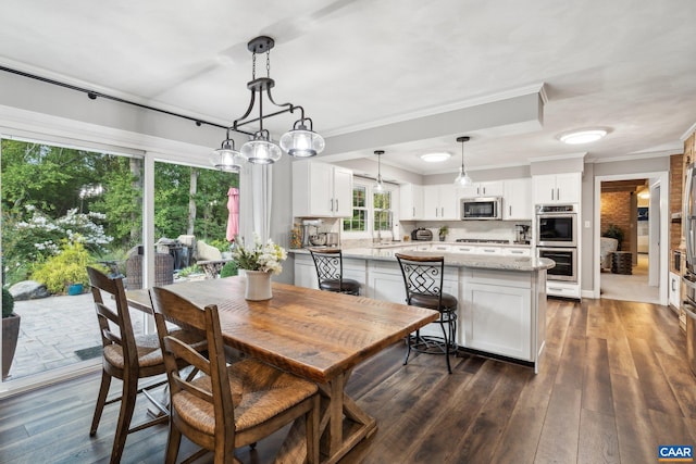 6904 James Madison Hwy, Fork Union, VA 23055 - dining space featuring crown molding and dark wood-style flooring