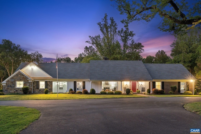 6904 James Madison Hwy, Fork Union, VA 23055 - ranch-style house featuring a yard, board and batten siding, a chimney, and curved driveway