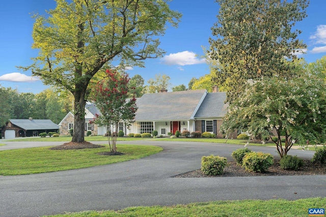 6904 James Madison Hwy, Fork Union, VA 23055 - ranch-style house with a front lawn, a chimney, and curved driveway