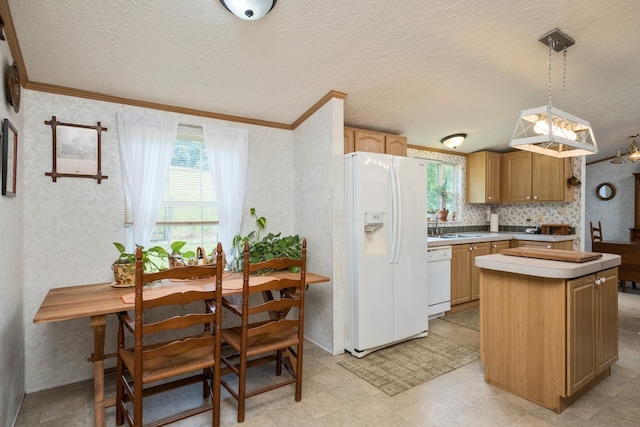 554 Harris Cove Ln, Elkton, VA 22827 - kitchen featuring white appliances, crown molding, a kitchen island, light countertops, and pendant lighting
