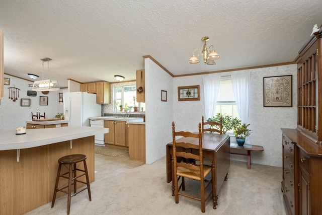554 Harris Cove Ln, Elkton, VA 22827 - dining space with crown molding, a chandelier, light carpet, and a textured ceiling