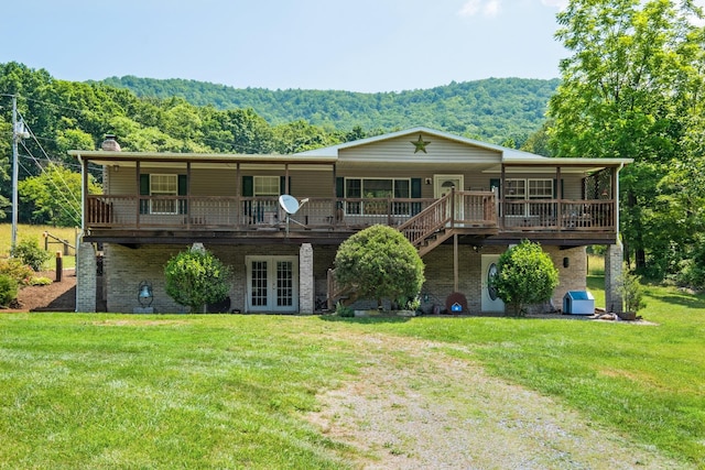 554 Harris Cove Ln, Elkton, VA 22827 - back of property featuring french doors, a yard, a forest view, and a wooden deck