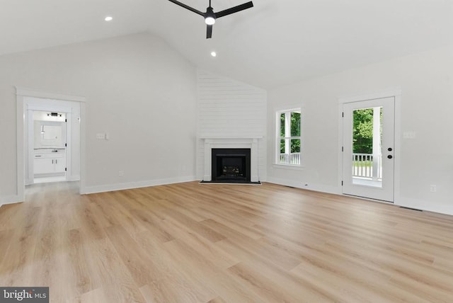 195 Promise Ln, Bumpass, VA 23024 - unfurnished living room with a ceiling fan, a large fireplace, light wood-style flooring, high vaulted ceiling, and recessed lighting