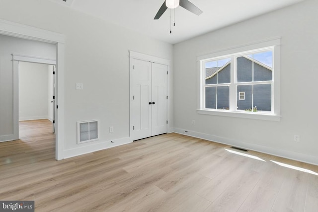 195 Promise Ln, Bumpass, VA 23024 - unfurnished bedroom with light wood-type flooring, baseboards, a ceiling fan, and a closet