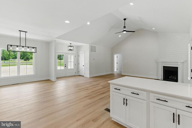 195 Promise Ln, Bumpass, VA 23024 - unfurnished living room with baseboards, a fireplace, lofted ceiling, ceiling fan, and recessed lighting