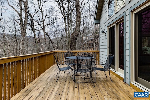 deck with outdoor dining space