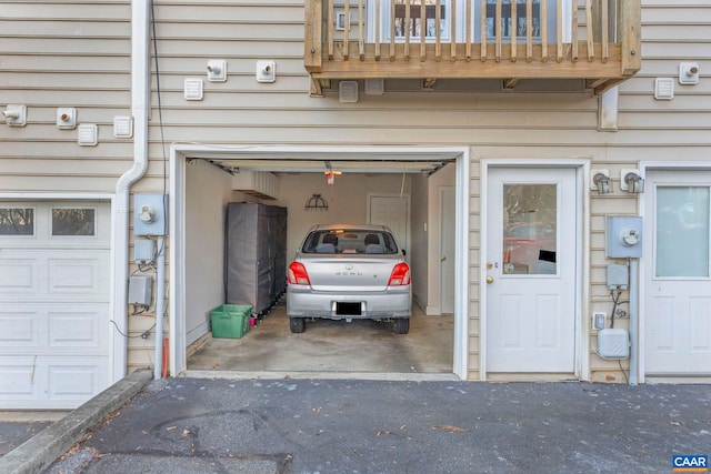 garage featuring aphalt driveway