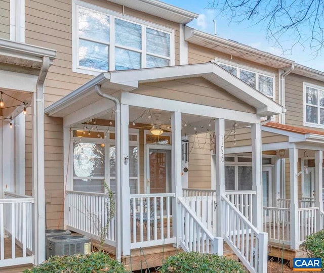 doorway to property featuring central AC unit and covered porch